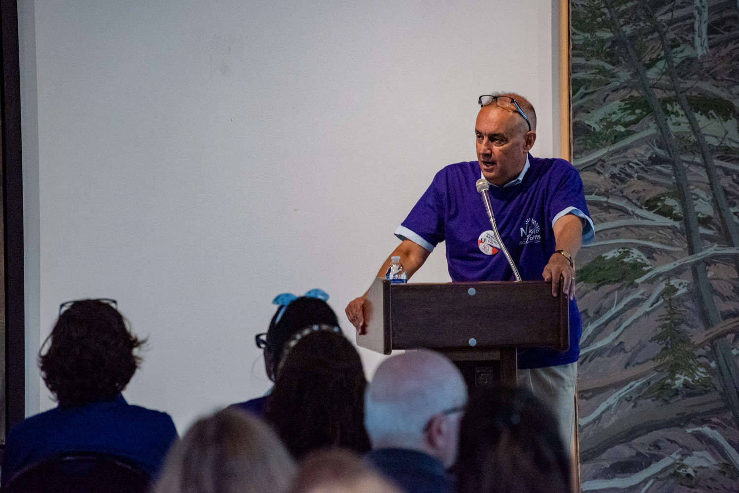 Doug Schoenberger speaking at the podium on NJ Nonprofits Advocacy Day. (Photo by Tim Sexton)